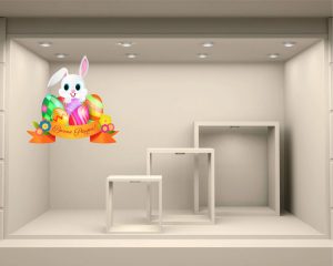Simpatico coniglietto tra uova-adesivo per vetrine